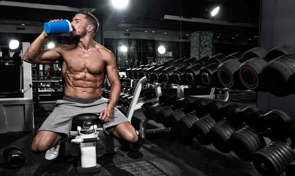 man drinking a protein shake after a workout